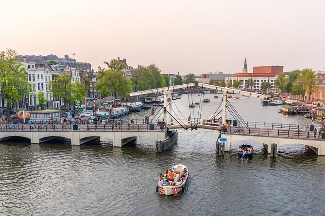 Amsterdam Luxury Canal Cruise + Unlimited Drinks & Bites option - Anne Frank House and Westerkerk from the water