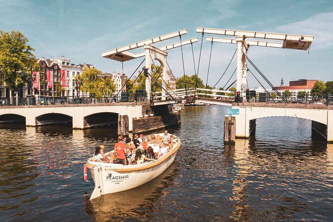 Amsterdam Luxury Canal Cruise + Unlimited Drinks & Bites option - Summer open boats versus cold-weather cabins