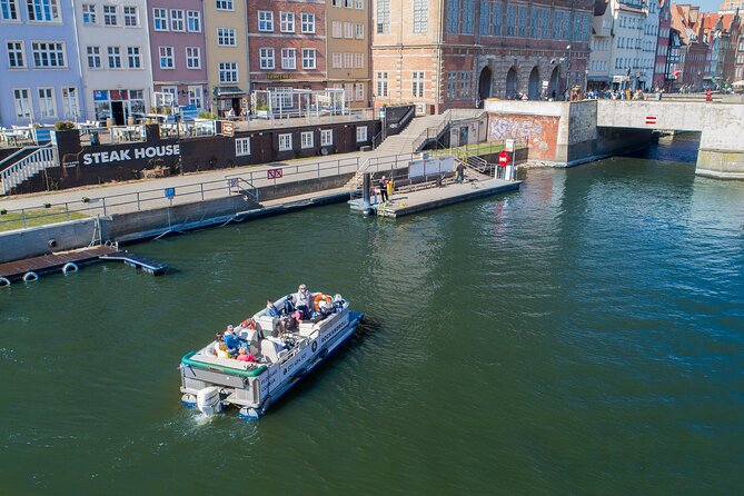 Cruises on the Motlawa River by a luxury catamaran - Gdańsk from the water side - Boarding at the Green Bridge