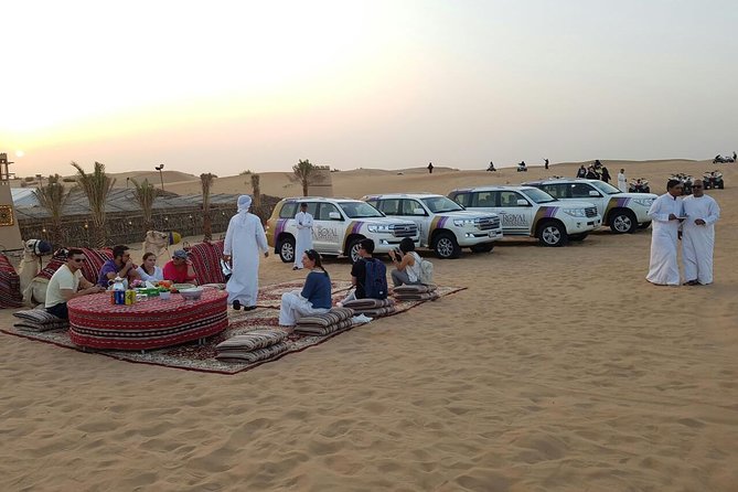 Dubai Desert Safari evening with VIP Treat , BBQ Buffet and Exciting Liveshows - Sunset photos, sandboarding, and short camel rides