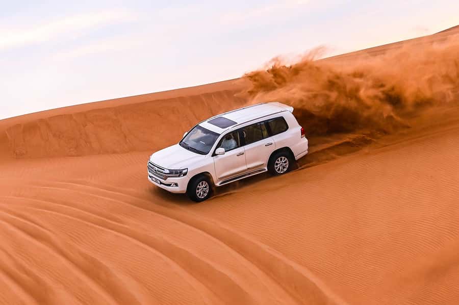 Dubai: Desert Safari with VIP BBQ and Optional Quad Bike - Sunset photos and sandboarding on the dunes