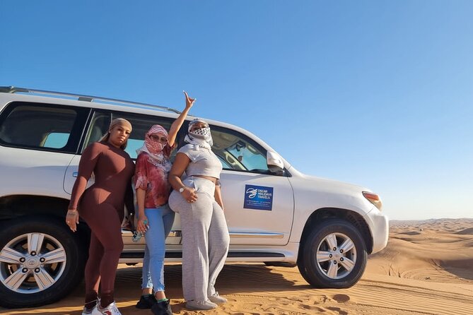 Dubai Red Dunes with Sandboarding, Camel Ride, Falcon & VIP Camp - A short camel ride and twilight in the desert