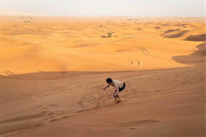 Dubai Red Dunes with Sandboarding, Camel Ride, Falcon & VIP Camp - Sunset photography at Lahbab