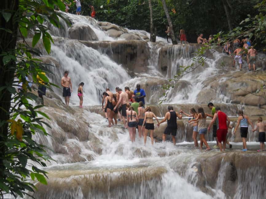 Falmouth: Dunn’s River Falls & Bamboo Beach Club VIP Access - Climbing Dunn’s River Falls by hand