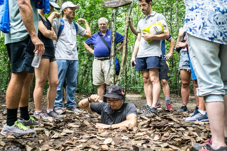 From Ho Chi Minh: Cu Chi Tunnels and VIP Speedboat Tour - Entering the narrow tunnel sections