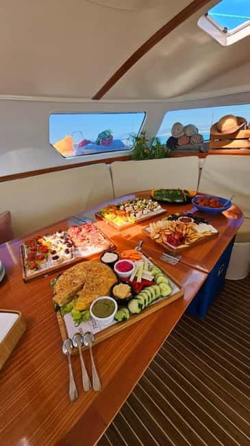 From Palma: Luxury Catamaran Group Tour with Tapas & Drinks - The crew and level of service