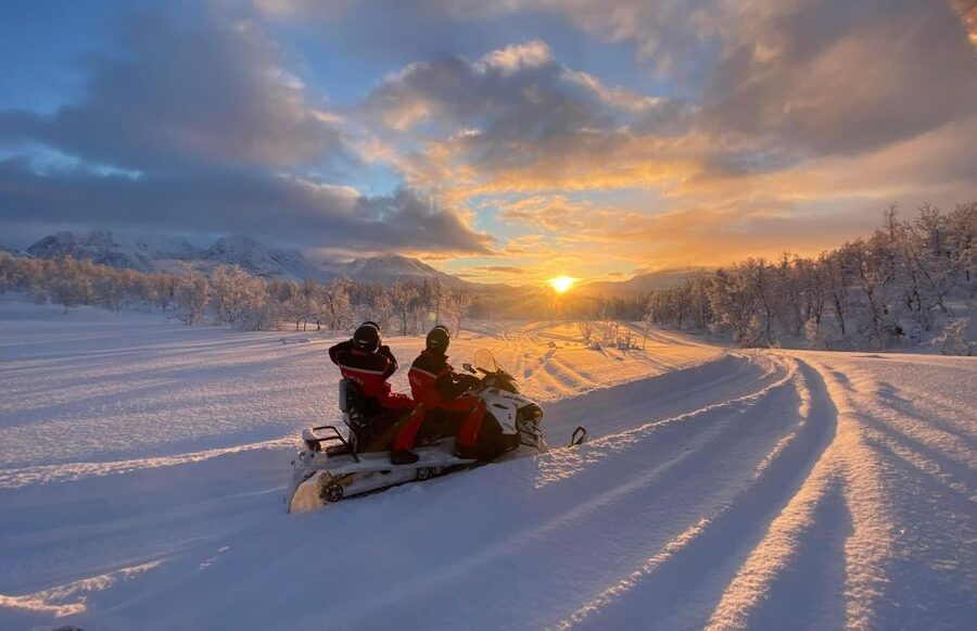 From Tromso: Eco Luxury Snowmobile Adventure to Lyngen Alps - Riding through the Lyngen Alps