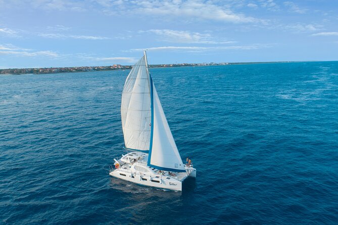 Half-Day Luxury Sailing Experience in Tulum with Open Bar - Boarding the catamaran and finding your rhythm