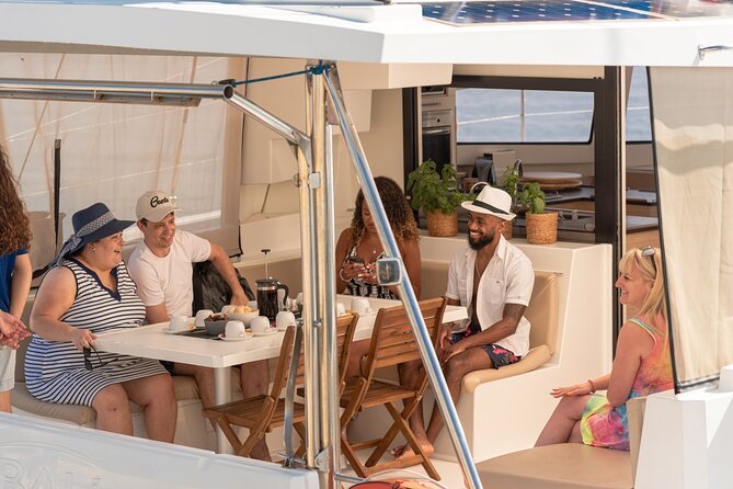 Hersonissos: Luxury Sunset Catamaran Cruise Sushi & Open Bar - Leaving Hersonissos with a glass of Prosecco