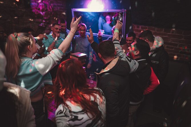 Krakow Club Crawl with 1 Hour Free Alcohol & Free VIP Entrance - A photographer records the night