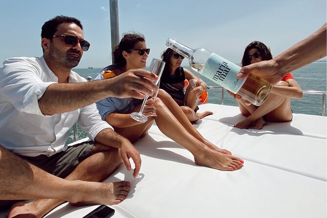 Lisbon: Catamaran Luxury Sunset and Wine Tour - Boarding at Belém and getting settled