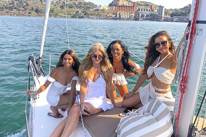 Lisbon Private Luxury Boat Tour with Welcome Drink - Crossing beneath the 25 de Abril Bridge