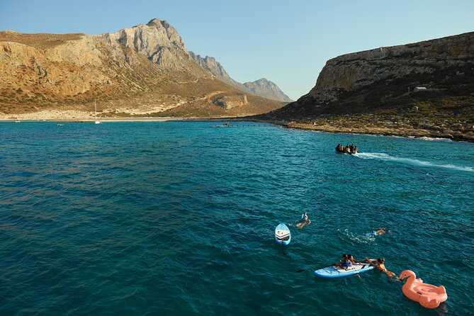 Luxury Balos Cruise: Sunset, Snacks, Drinks & Transfer - Snacks, drinks, music, and the sunset return