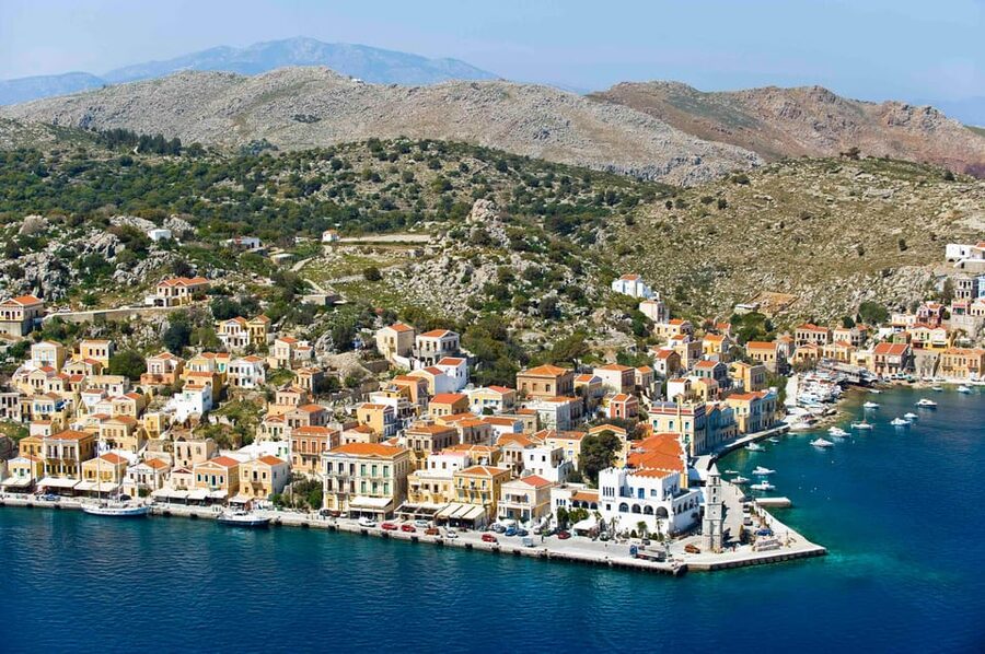 Luxury Boat Trip to Symi Island with Swimming at St. George - Arriving in Symi Harbor
