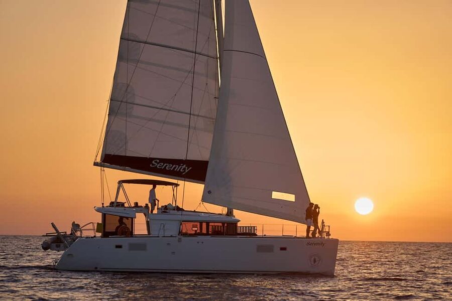 Luxury Catamaran Sunset Cruise with BBQ Fresh Fish & Drinks - A six-hour Santorini day built around the sea