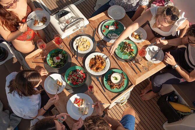 Luxury Catamaran Sunset Private & Greek Gastronomy in Athens - Vouliagmeni Beach and lunch on the shore