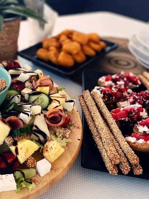 Luxury Catamaran to Balos: Sunset, Snacks, Drinks & Transfer - Cretan snacks, fruit, and drinks onboard
