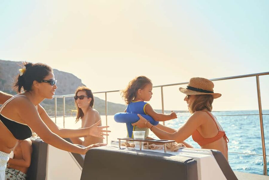 Luxury Catamaran to Balos: Sunset, Snacks, Drinks & Transfer - Balos Lagoon: pink sand, turquoise water, and steep cliffs