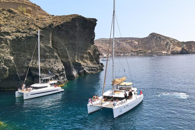 Luxury Santorini Sunset Cruise: Dinner, BBQ, Open Bar, Transfers - Dinner, BBQ, and an open bar at sea