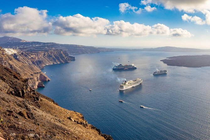 Luxury Small-Group Catamaran Cruise with BBQ, Open bar & Transfer - Thirasia and the caldera from sea level