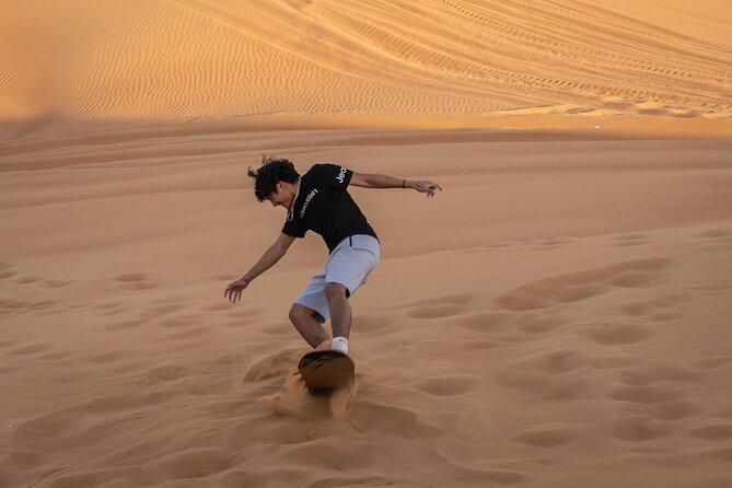 Premium Red Dunes Bashing with Quad Bike, Camel, Falcon &VIP Camp - Quad biking at Lahbab, with no license required