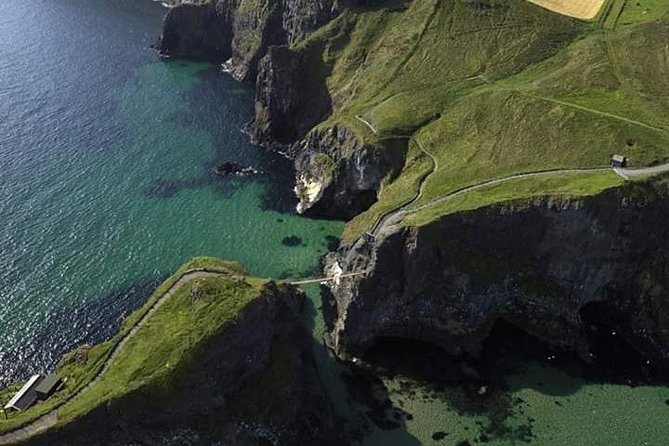 Private Luxury Mercedes Rope Bridge Giants Causeway Coastal Tour - Dunluce Castle and the stories behind the ruins