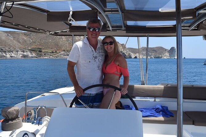 Private Luxury Santorini Catamaran Cruise with Port Pickup - A Greek meal served at anchor
