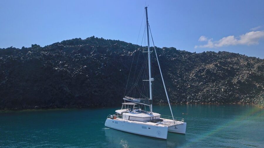 Santorini: Caldera Luxury Catamaran Cruise w/ Meal & Drinks - White Beach, Mesa Pigadia, and the volcanic coast
