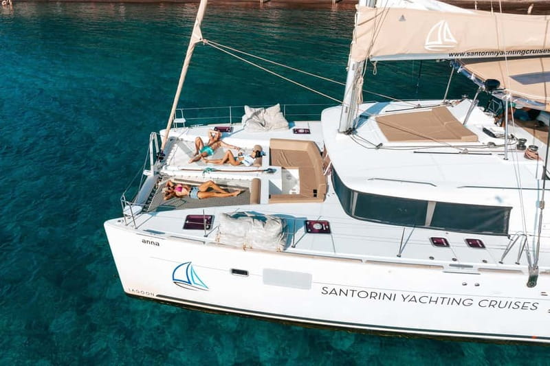 Santorini: Luxury Catamaran Cruise with Lunch, BBQ & Drinks - Red Beach and the volcanic south coast