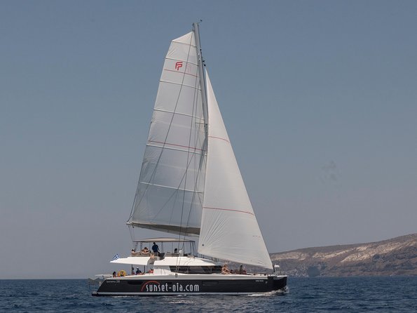 Santorini Luxury Catamaran Day Cruise with BBQ,drinks,transfer - Why seeing Santorini from the water changes the island