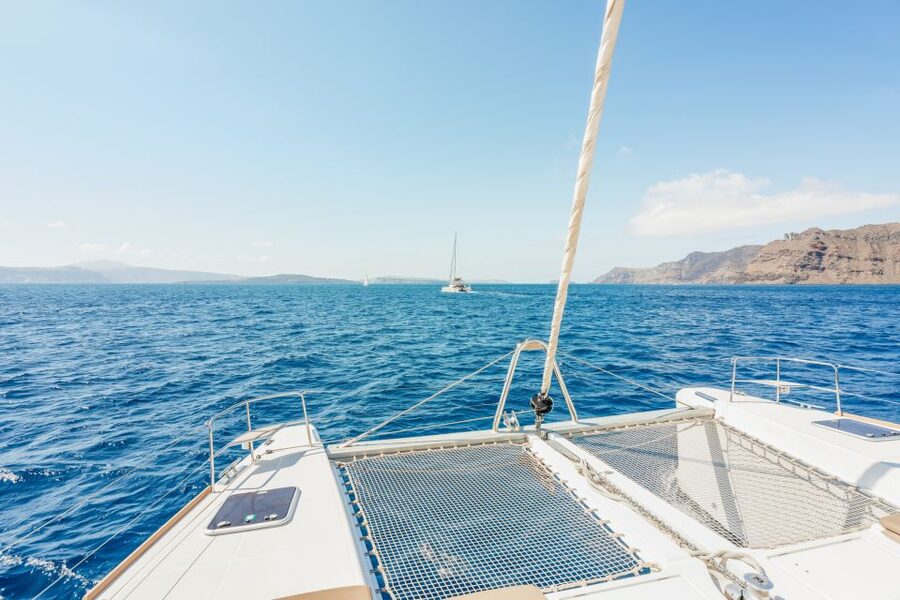Santorini: Luxury Catamaran Day Trip with Meal and Open Bar - Red Beach from the water