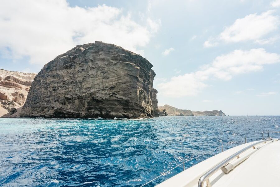 Santorini: Luxury Catamaran Day Trip with Meal and Open Bar - White Beach caves and the snorkeling stops