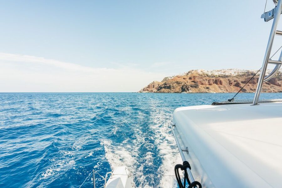 Santorini: Luxury Catamaran Day Trip with Meal and Open Bar - The caldera views between stops