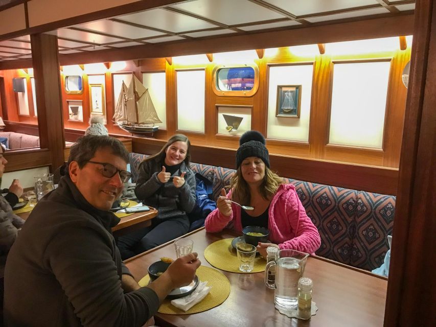 Tromso: Luxury Northern Lights Cruise with Hot Tub & Dinner - Reindeer stew and a warm saloon