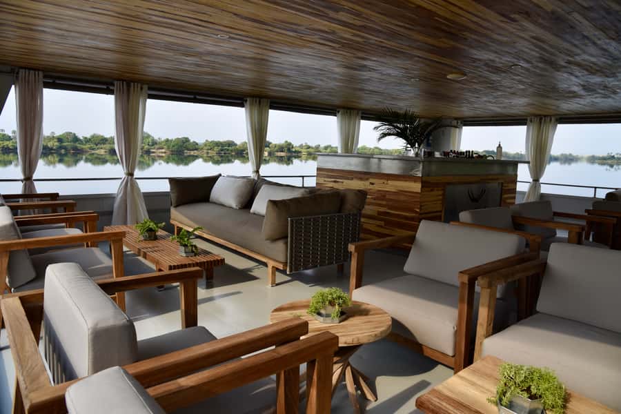 Victoria Falls: 2-Hour Luxury Zambezi River Sunset Cruise - Sunset and the distant spray of Victoria Falls