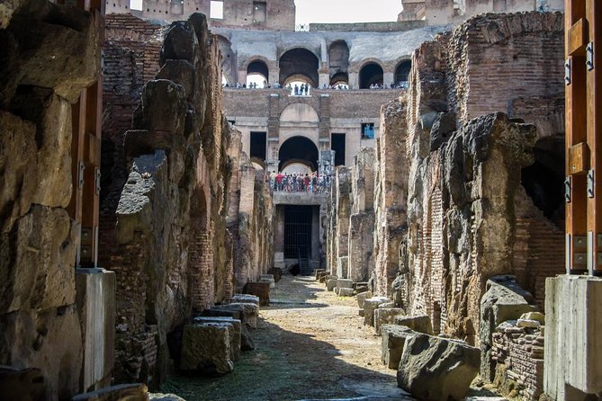VIP Colosseum Underground and Ancient Rome Small Group Tour - Entering the Colosseum through the Arena