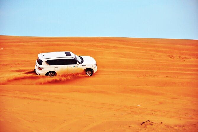 VIP Desert Safari & Dune Bashing with 5<em> Live BBQ – Key points to know before booking’ /></p>
<ul>
<li><strong>Afternoon departure:</strong> Pickup begins around 3:00 pm, with the desert portion timed for late-day light and sunset.</li>
<li><strong>Several activities included:</strong> Dune bashing, sand boarding, a traditional camel ride, henna painting, falcon photos, and sunset stops are part of the package.</li>
<li><strong>Quad biking is optional:</strong> Confirm that you select the quad-bike option if you want to drive one.</li>
<li><strong>Premium camp dinner:</strong> The evening includes a buffet, live BBQ, unlimited mineral water and soft drinks, plus belly dancing, fire, and Tanoura performances.</li>
<li><strong>Shared 4×4 transport:</strong> You ride in a shared premium 4×4 vehicle with an English-speaking guide and driver.</li>
<li><strong>Plan for a full afternoon and evening:</strong> The return to Dubai is usually late, so avoid scheduling another major activity afterward.</li>
</ul>
<h2>Why this safari works well as a Dubai day out</h2>
<p><img width="669" height="446" decoding="async" src=