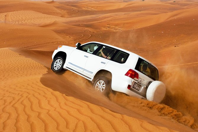 VIP Dubai Desert Safari with Dinner served at table and 3 live Shows - Dune bashing across the high red dunes