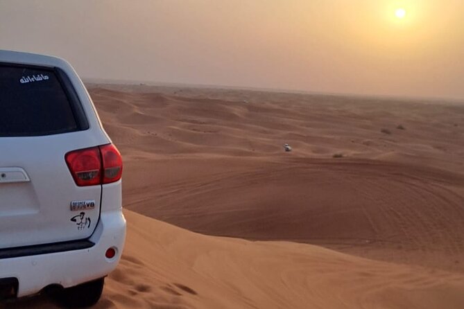 VIP Dubai Desert Safari with Quadbike,Sandboarding & BBQ dinner - A short camel ride leads into camp time