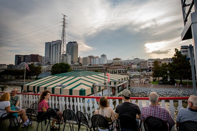 VIP Jazz Dinner Cruise with Private Tour and Open Bar Option - The river at dusk and the four-deck boat