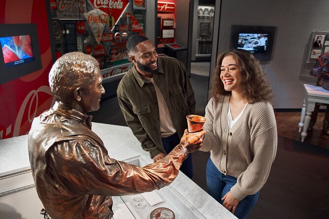 World of Coca-Cola Ticket & Guided Tour with VIP Polar Bear Photo - Interactive exhibits and the soda fountain mirror